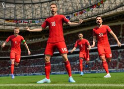 Piłkarze w czerwonych strojach na boisku z gry FIFA 23