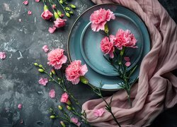 Różowe goździki na talerzu