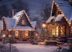 Rozświetlone lampkami udekorowane na Święta domy w śniegu