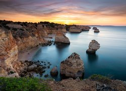 Wybrzeże, Skały, Morze, Zachód słońca, Ocean Atlantycki, Region Algarve, Portugalia