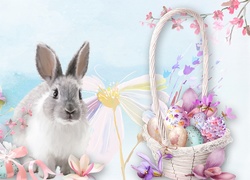 Wielkanocna kompozycja z królikiem wśród kwiatów i koszyczkiem z pisankami