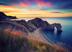 Anglia, Morze, Wybrzeże Jurajskie, Łuk wapienny Durdle Door, Zachód słońca, Skały, Plaża