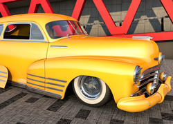 Żółty zabytkowy samochód marki Chevrolet Fleetline rocznik 1948